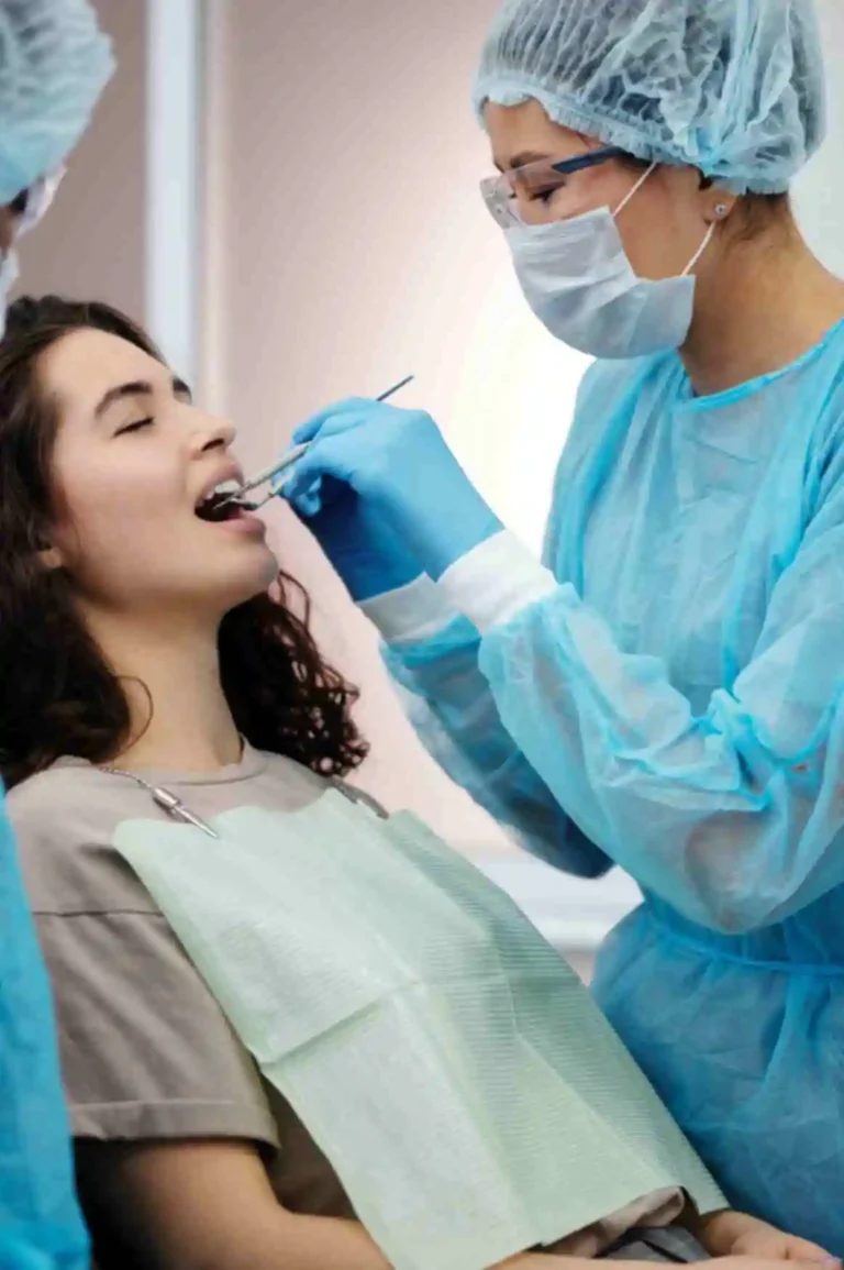 Dentist examining patient during checkup.